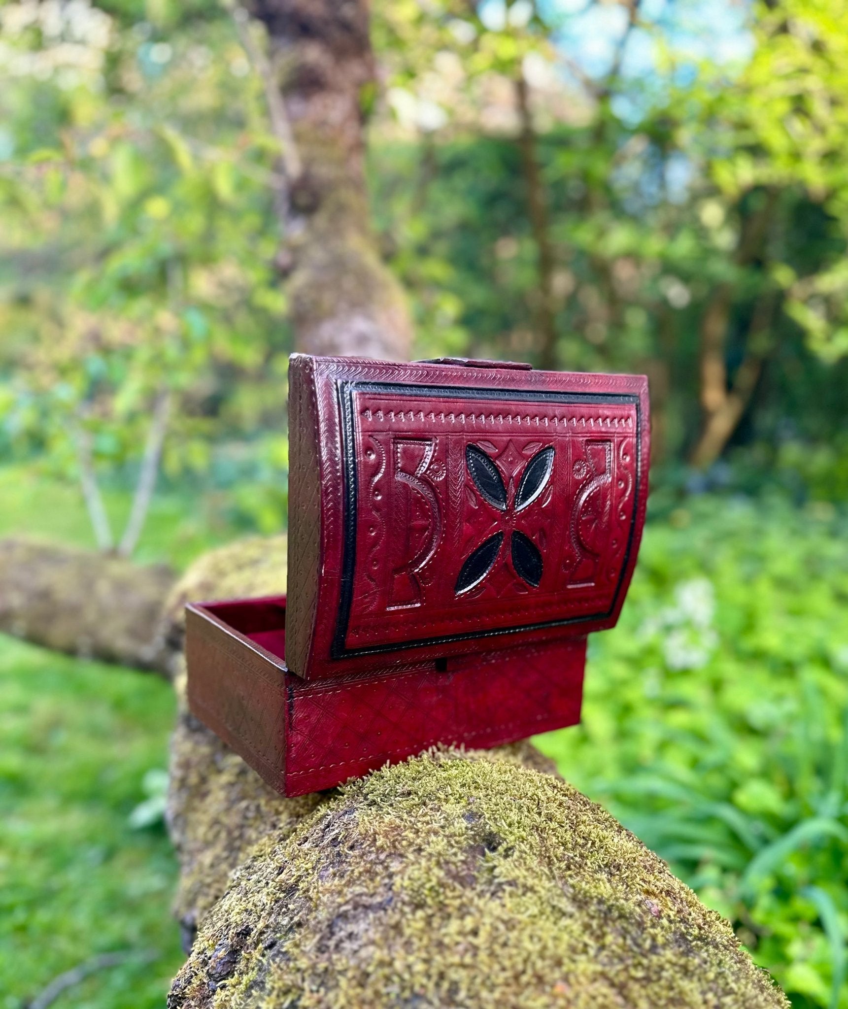 Tuareg red leather and wood box with hand carved designs on box. luxury African home accessories and crafts