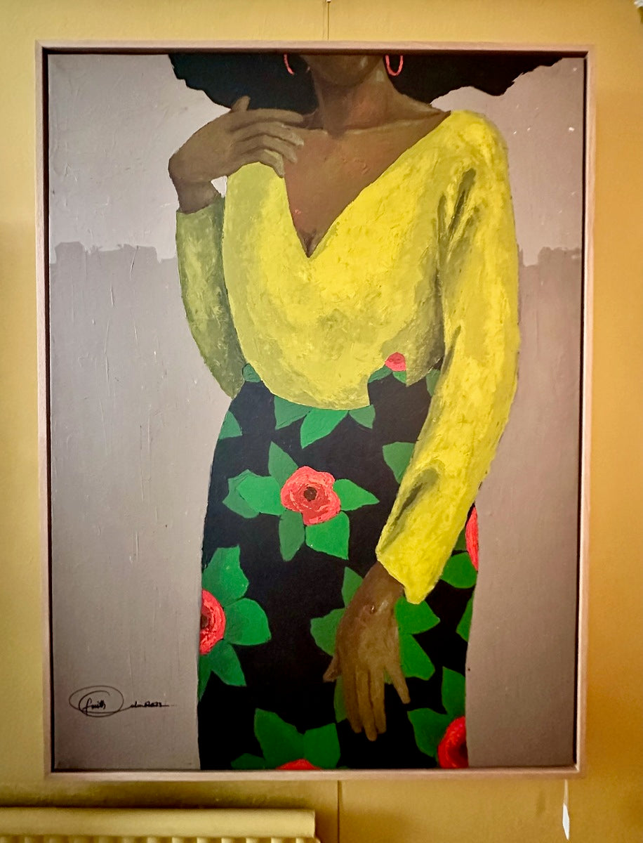 I Am Woman 2" by Faith O Sidneu is an acrylic on canvas painting of a dark-skinned woman in a yellow top and floral black skirt, her face hidden, with one hand on her chest and the other hanging at her side.