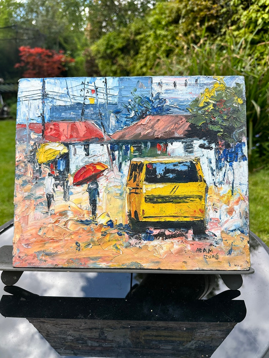 The Adam Textured Miniature Painting is an acrylic on canvas artwork featuring a yellow van, umbrella-carrying people, red-roofed buildings, lively rainy scenes, vibrant brushstrokes, greenery, and includes a certificate of authenticity.