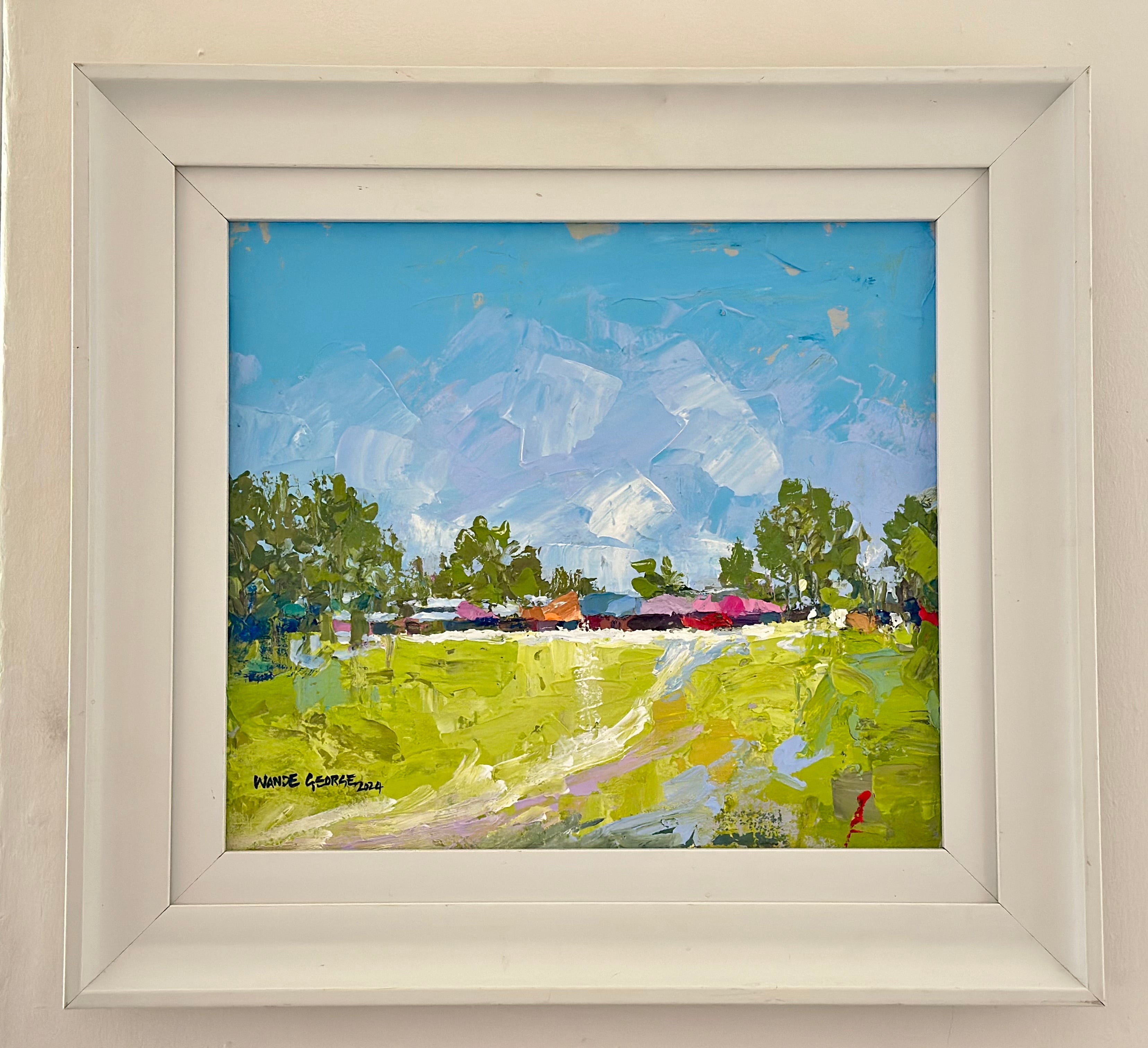 Long Awaited Visit" by Wande George is a framed acrylic on canvas featuring vibrant green fields, scattered trees, and a bright blue sky in bold, textured brushstrokes. The artist's hand signature appears in the bottom left corner.