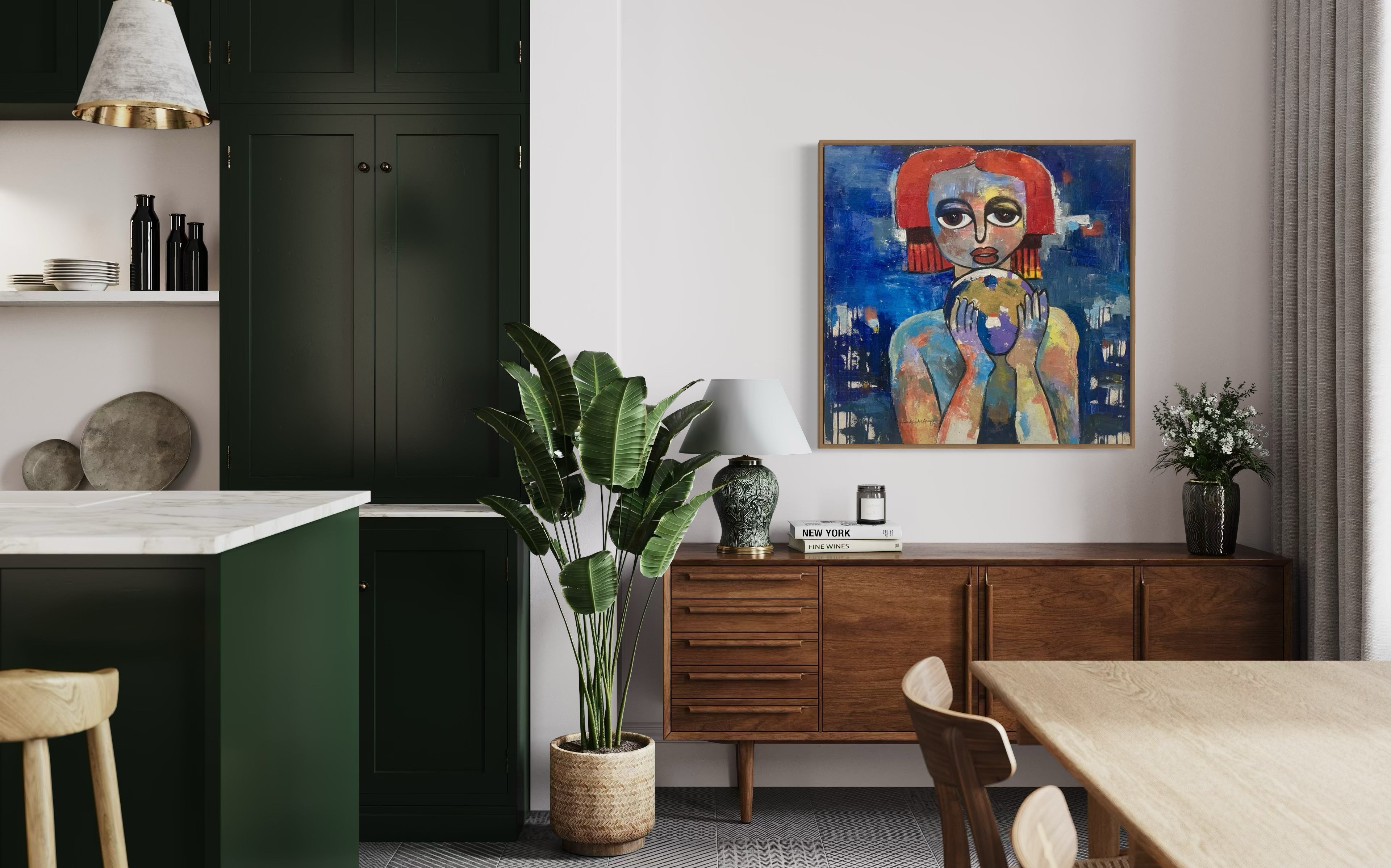 Modern dining area with green cabinets, wooden sideboard, potted plant, and "My World, Destiny Is In My Hands" by Achike Anayo—a colorful abstract portrait that comes hand-signed with a certificate of authenticity. Natural light fills the space.