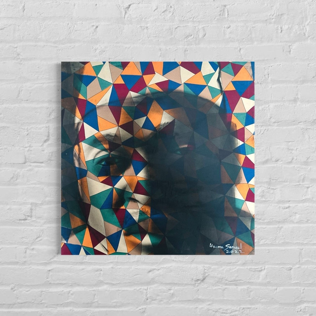 Abstract Figurative portrait 'Self' by Uzoma Samuel features a geometric human face in blue, red, yellow, and beige acrylic on canvas, framed and signed. The artwork blends triangular and diamond shapes with striking abstract detail.