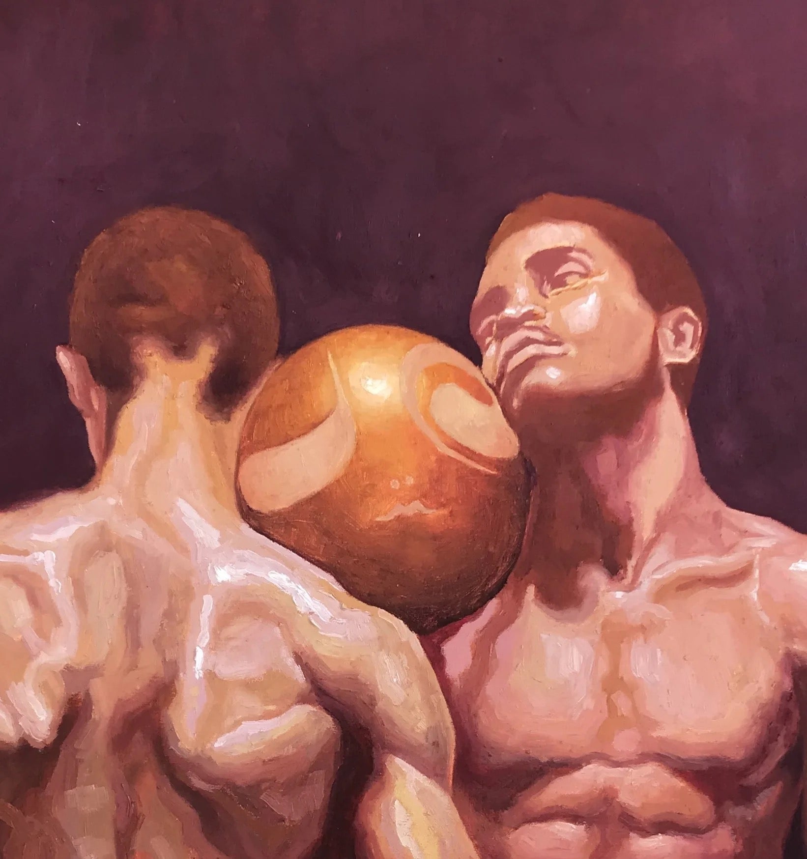 Attached" by Emmanuel Ugwu is an oil painting showing two shirtless men—one facing away, one forward—with a large orange and white ball between their heads, symbolizing intimacy and connection against a dark backdrop.