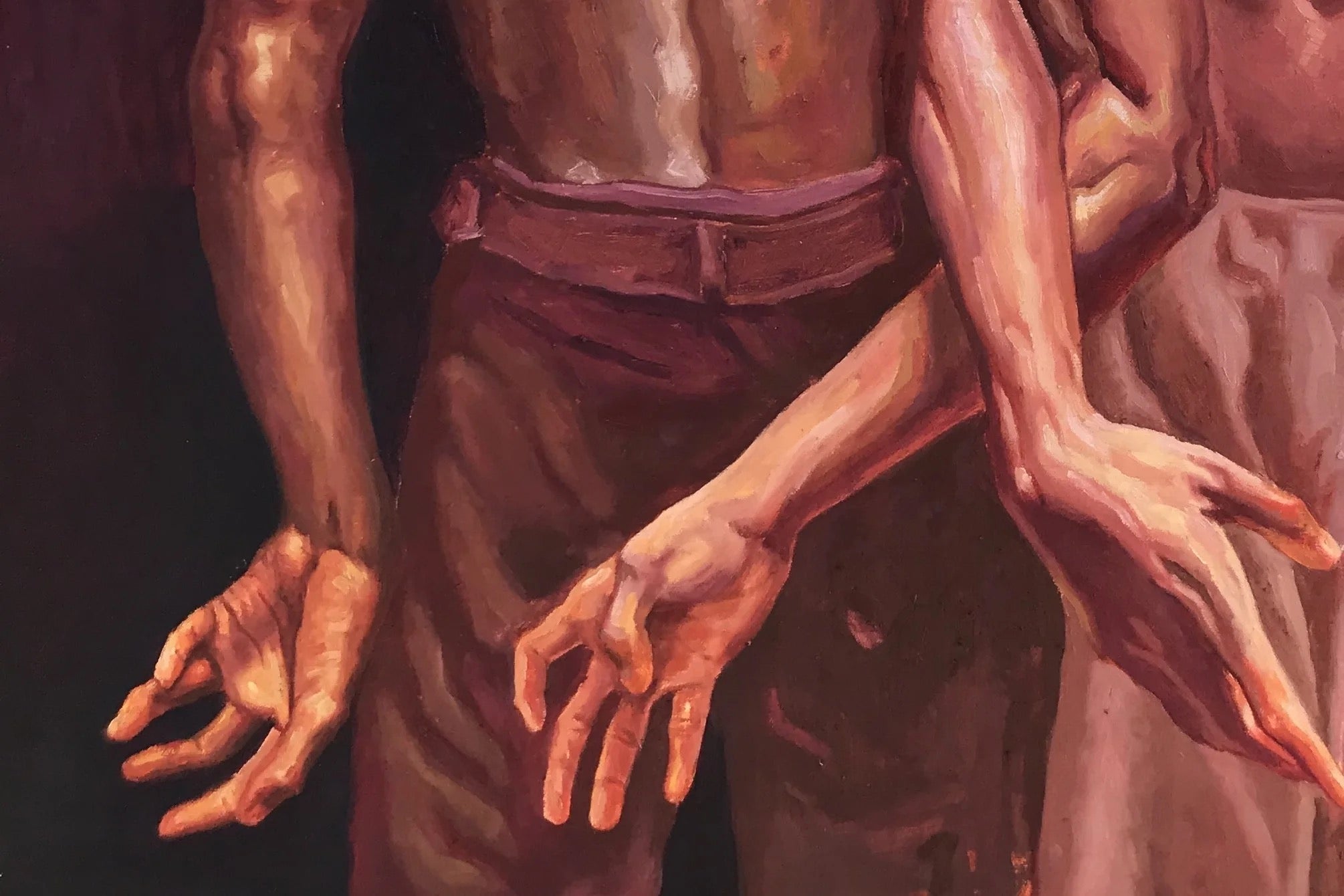 In "Attached" by Emmanuel Ugwu, two people stand close, their outstretched, intertwined arms and hands warmly lit against a dark background, capturing intimacy. Their torsos and part of a dress are partially visible.