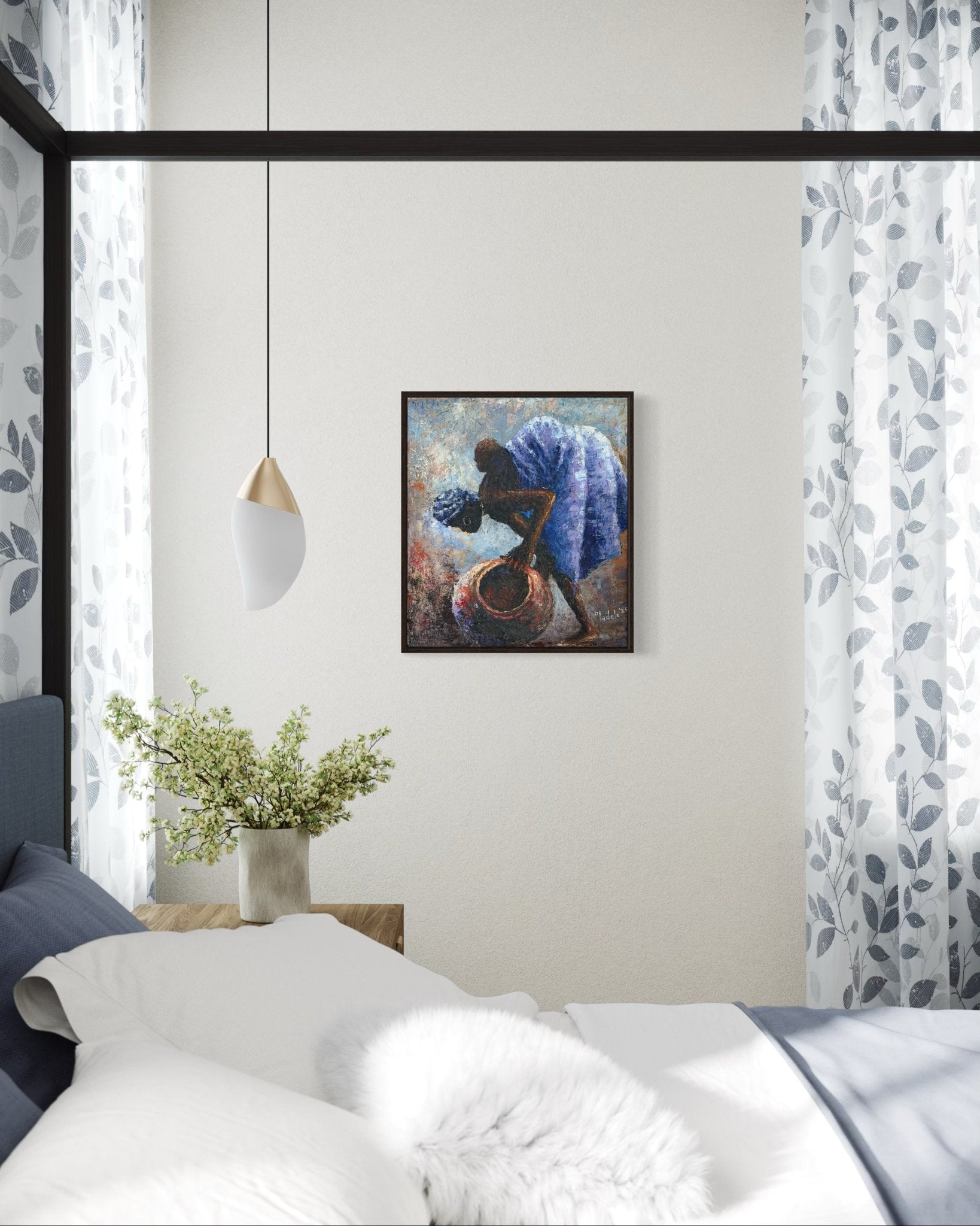 A cozy bedroom features a bed, nightstand with a vase of green branches, sheer leaf-patterned curtains, and "Backed Up" by Sunday Oladele—a striking Nigerian art piece of a figure carrying a pot. A modern white and gold pendant light hangs nearby.