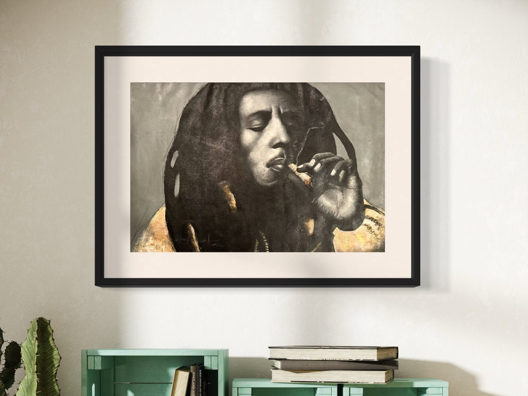 The Bob Marley Mixed Media Monochrome Painting by Kehinde Badmuss is displayed on a light wall above pale green shelves and a small potted cactus.
