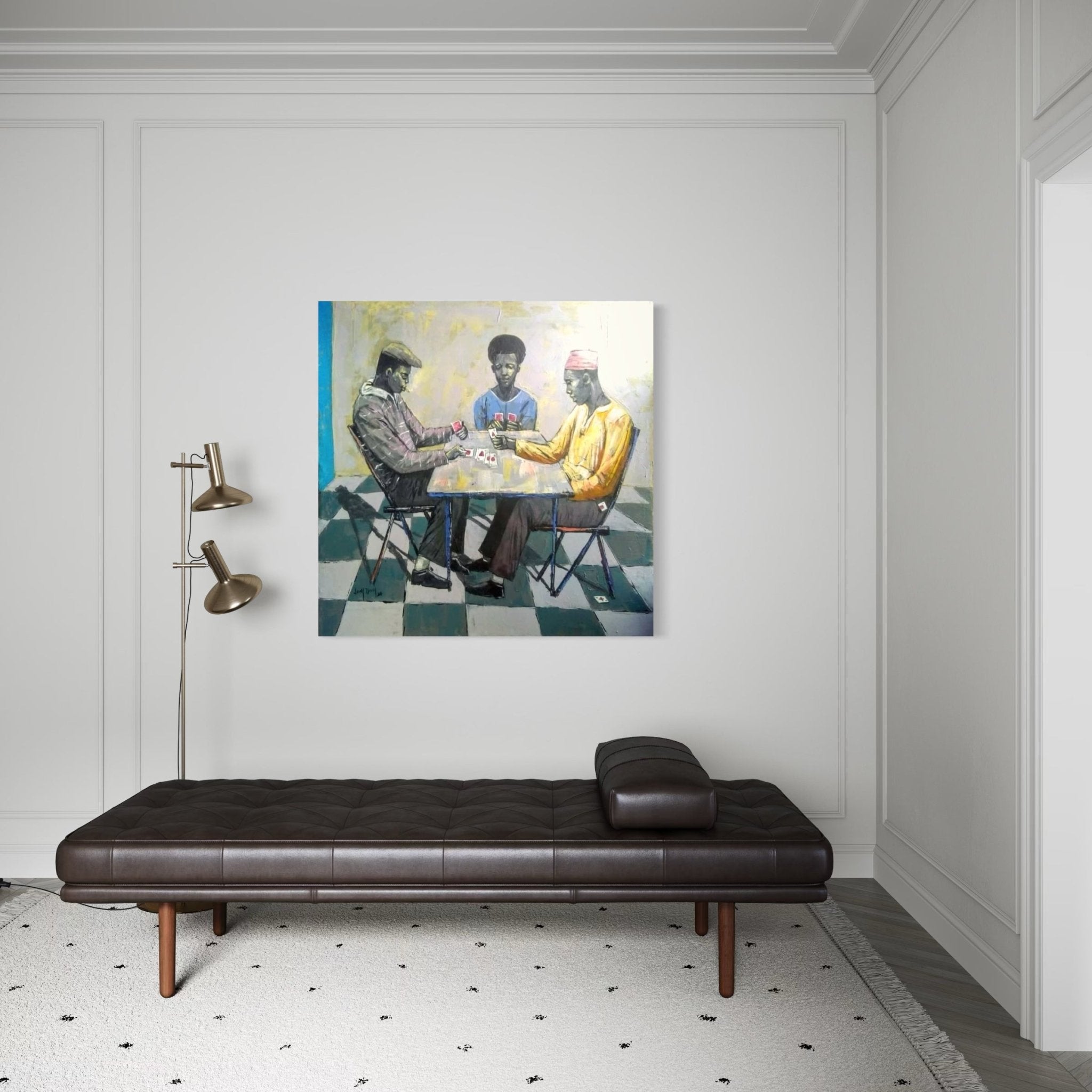 A minimalist room with a dark leather daybed, modern floor lamp, and "Cartels" by Lucky Isaiah—unique artwork of three men playing cards on a checkered floor, complete with certificate of authenticity.