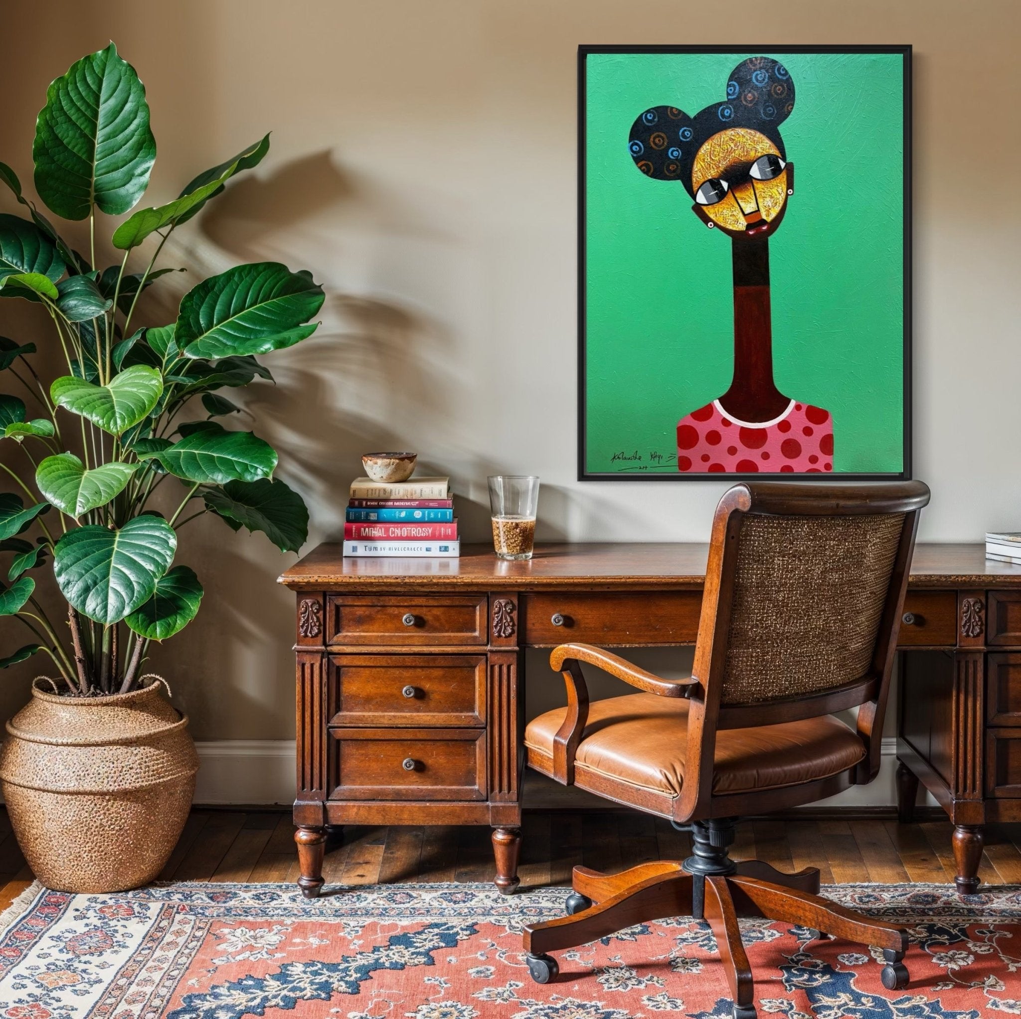 A home office featuring a vintage wooden desk, leather chair, potted plant, and the Contemporary Figurative Painting by Kolawale Niyi hanging above the desk.