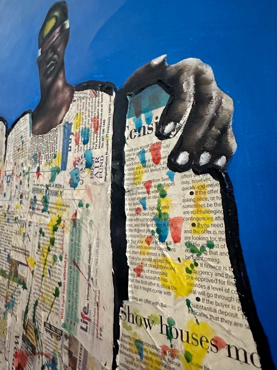 Friendship" by bibianna.co.uk is a mixed media acrylic painting of a dark-skinned person in green sunglasses holding a newspaper collage with bright paint splatters, set on a solid blue background.