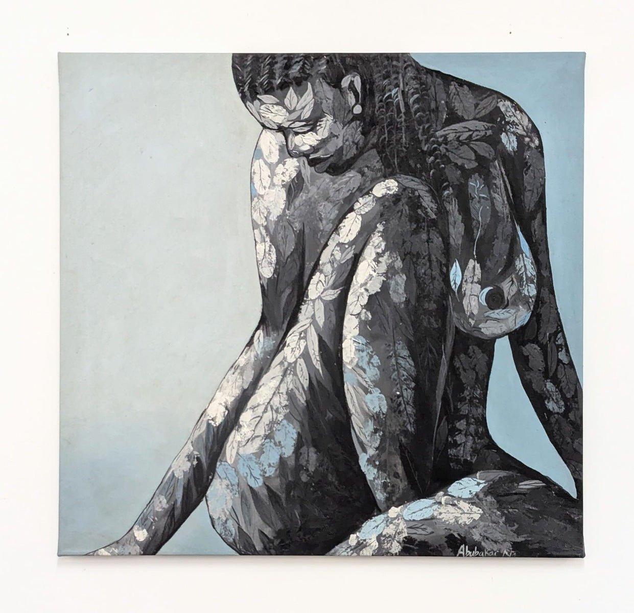 Graceful African Figurative Painting with Botanical Textures, 'Nude 2' by Abubakar Nurudeen: a grayscale acrylic on canvas of a seated nude woman with knees up, head bowed, and white and light blue leaf-like patterns. Hand-signed by the artist.