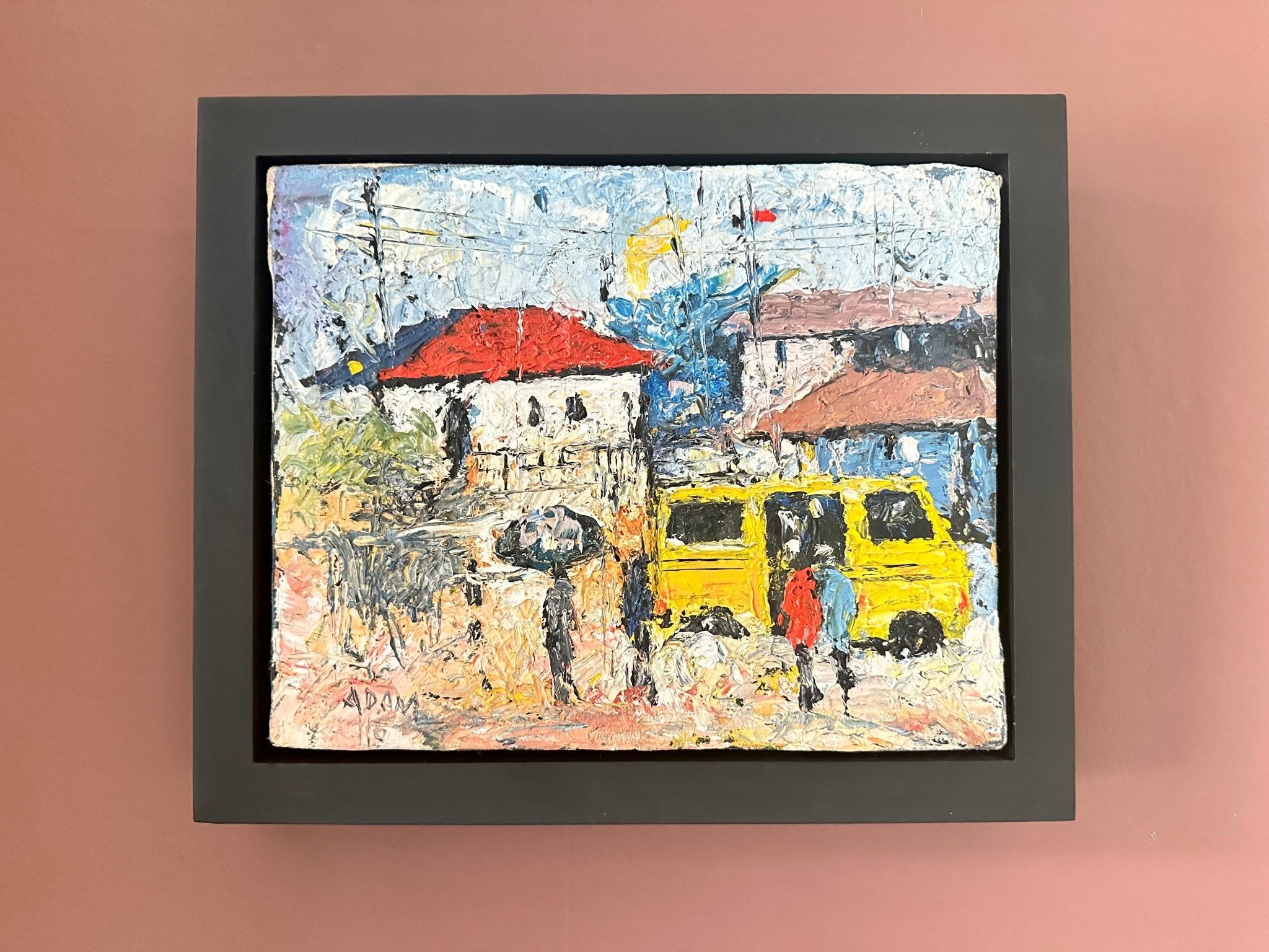 Heavily Textured Miniature Acrylic On Canvas Painting by Adam, "Danfo Bus": a framed Nigerian street scene with a yellow bus and people, set against red-roofed buildings under a blue sky. Brand: Adam.
