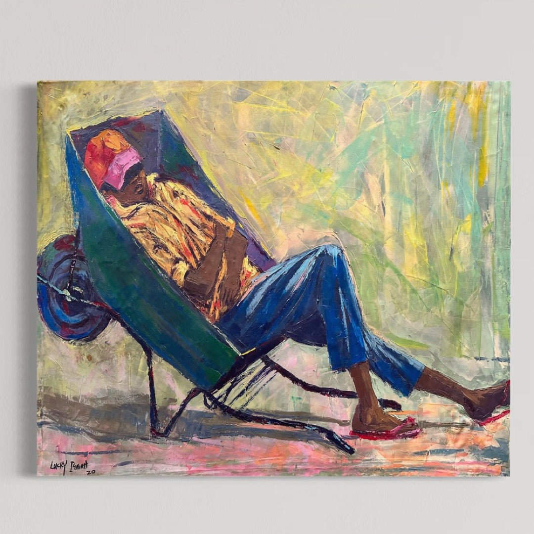 “Hope In God” by Lucky Isaiah: an original hand-signed expressionist painting showing a man napping in a green wheelbarrow, wearing a pink cap, orange shirt, blue pants, and red sandals on an abstract yellow-green background.