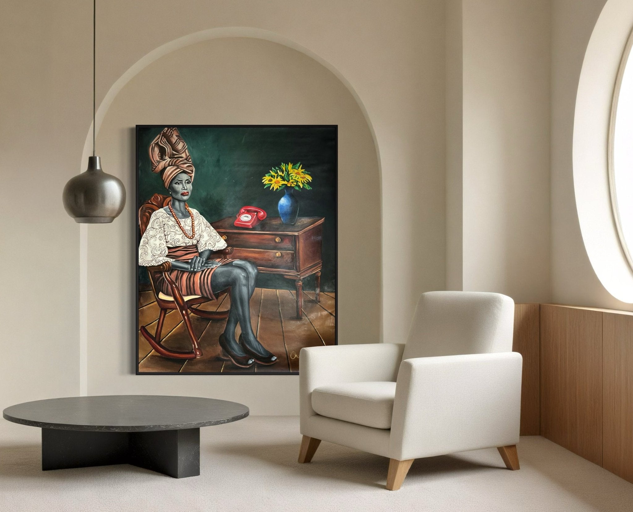 A modern, minimalist room features a round table and white armchair. On the wall hangs 'I Am Ready,' a regal vintage portrait by Azeez Okulaja of a Yoruba woman in traditional Iro, Buba, and Gele by a desk with a red rotary phone and yellow flowers.