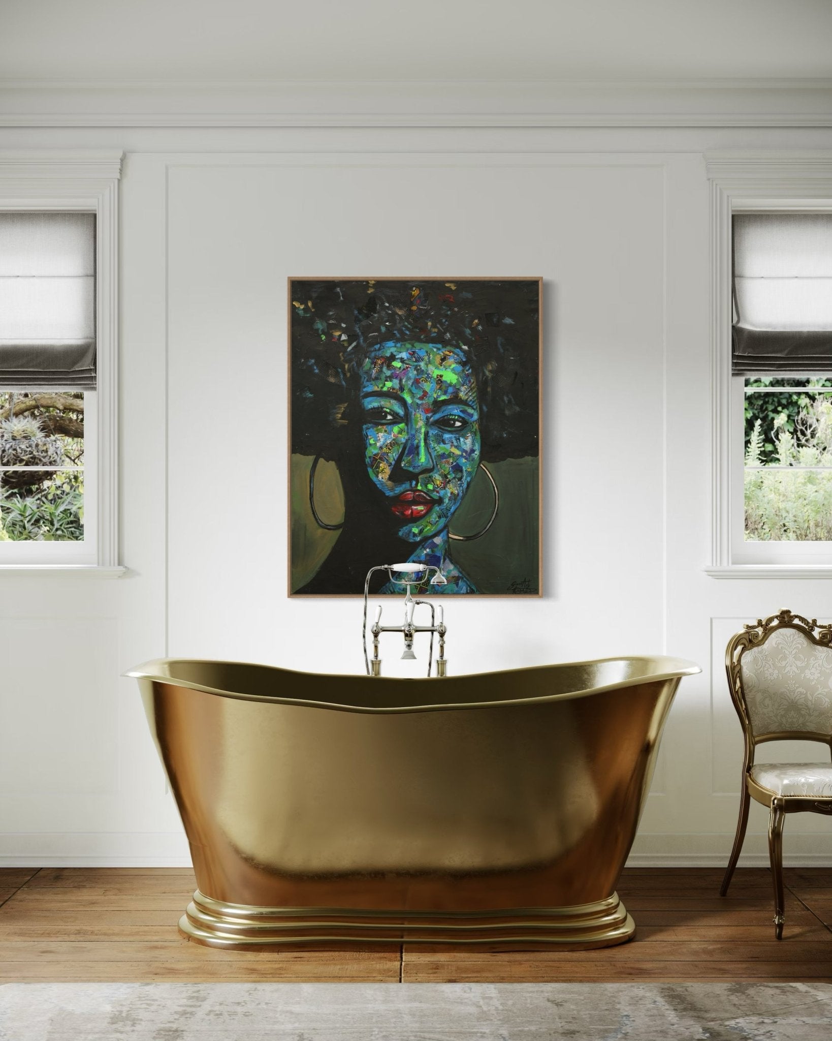 A stylish bathroom features a gold freestanding bathtub, Izuchukwu Giver’s 'Independent' Mixed Media Ankara fabric Collage And Acrylic Painting above the tub, white walls, two windows with Roman shades, and an ornate chair to the right.