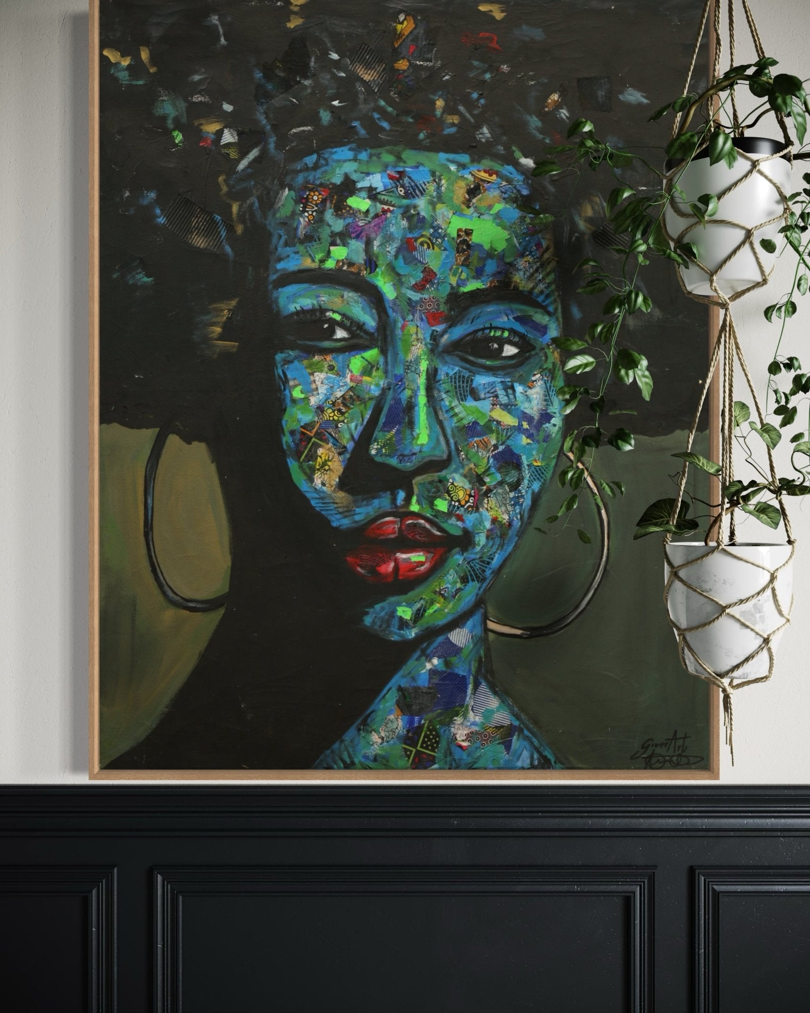 The 'Independent' Mixed Media Ankara fabric Collage And Acrylic Painting by Izuchukwu Giver, featuring a woman with large hoop earrings and vivid colors, hangs on a wall beside two potted plants in white hanging planters.