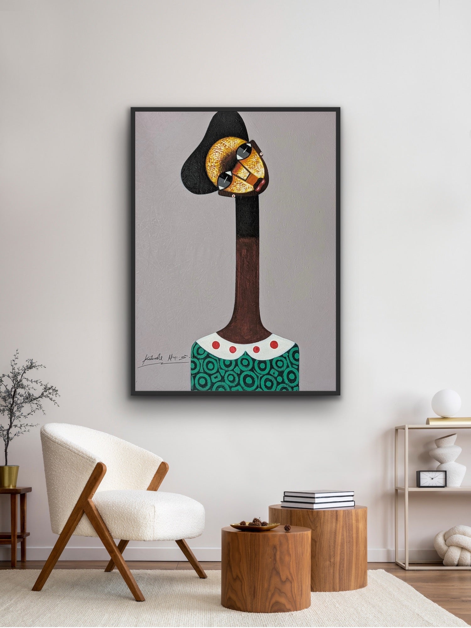 A modern living room featuring the Kolawale Niyi Cubist Portrait by Kolawale Niyi—an abstract, hand-signed acrylic on canvas with Certificate of Authenticity—depicting a stylized long-necked figure, plus a white curved chair and round wooden tables.