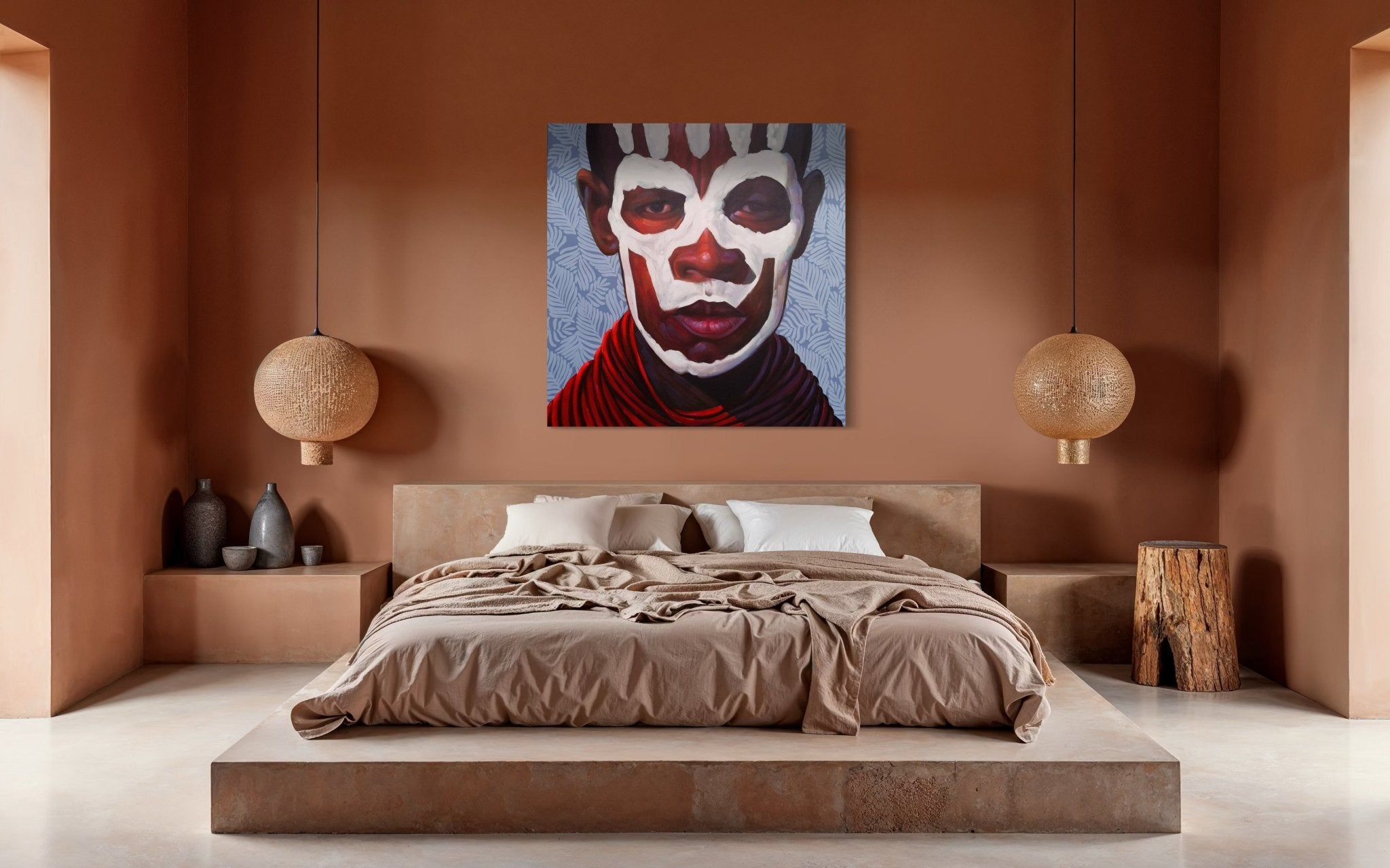 A modern bedroom with a minimalist beige bed, neutral bedding, pendant lights, ceramic vases, a wooden stump nightstand, and the Kwesi Koo Nyarkoh Original Impressionist Painting 3 featuring bold white and red face paint.