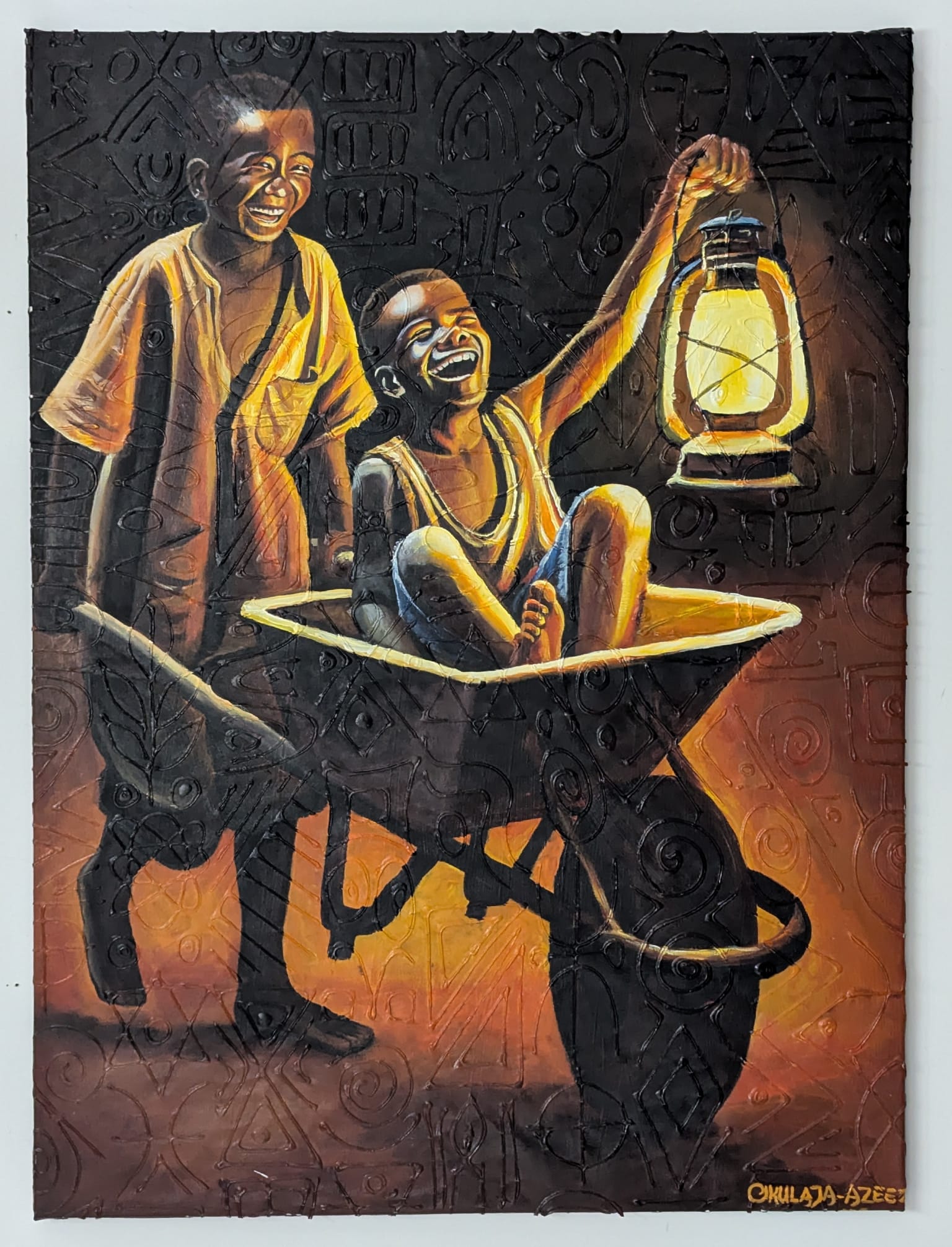 Lighten My Path" by Azeez Okulaja depicts two smiling children at night—one pushes the other in a wheelbarrow as they hold a glowing lantern, their joyful scene illuminated against a dark, patterned backdrop. Acrylic on canvas.