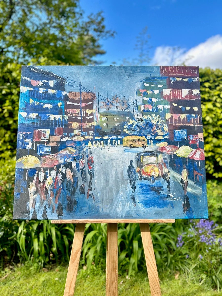The original "Marina, Lagos Island" by Obi is a vibrant contemporary painting featuring lively streets, people, vehicles, and glowing buildings at night, set outdoors amidst greenery and a blue sky—a stunning African art piece by Obi.