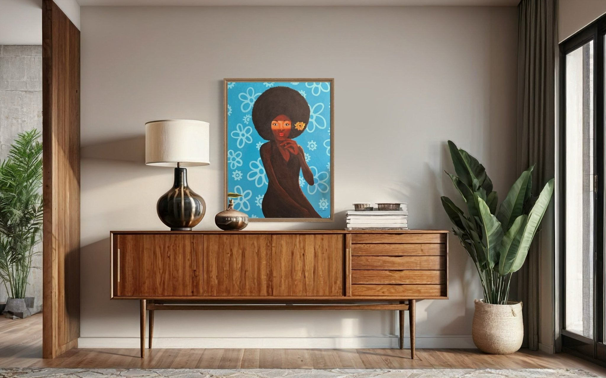 A modern living room featuring a wooden sideboard, table lamp, vases, potted plant, and "My Afro 2" by Afuope Opeyemi—a vibrant acrylic on canvas portrait of a woman with an afro against a blue background with white flowers.