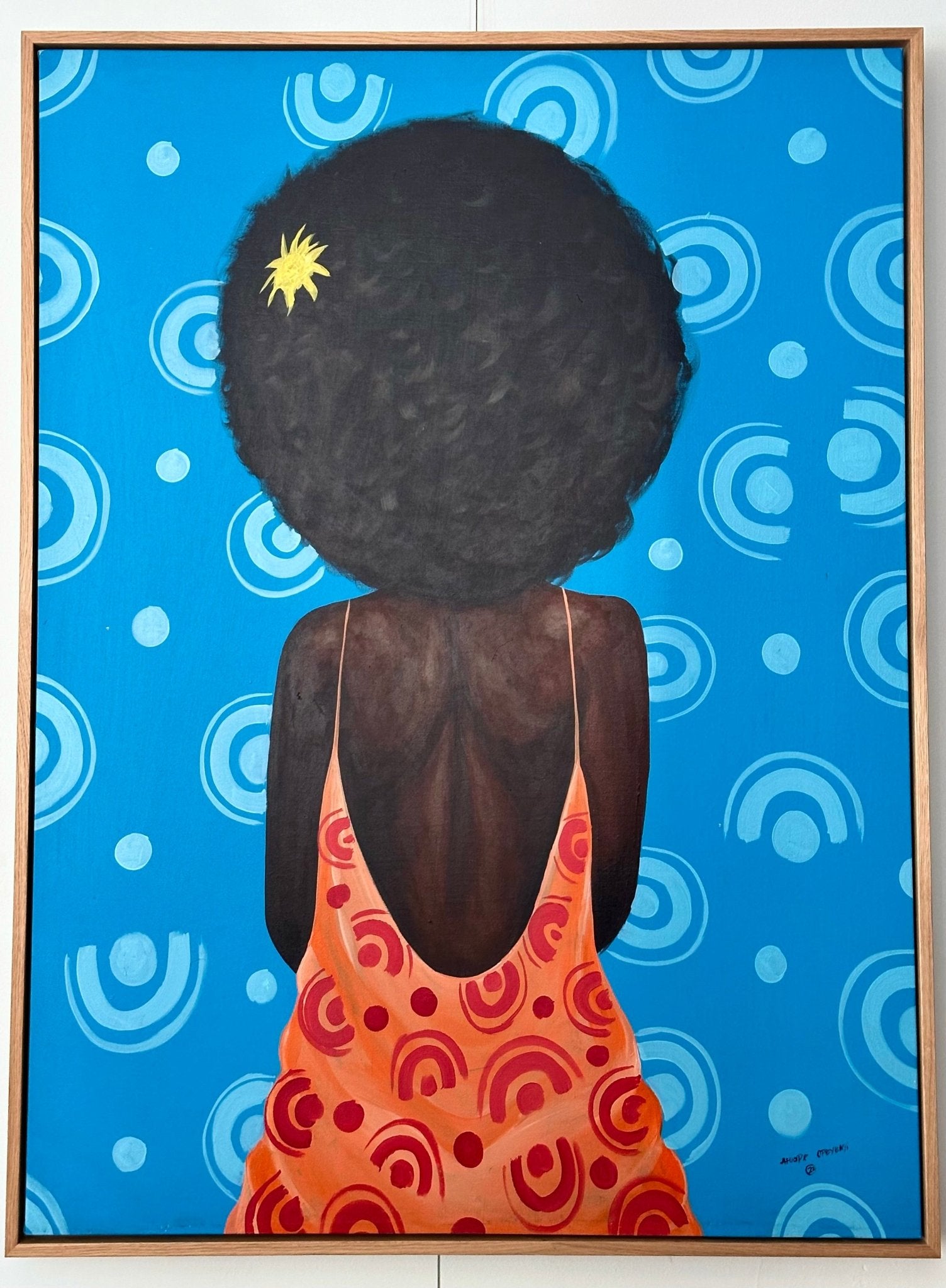 My Afro" Retro Portrait by Afuope Opeyemi shows a dark-skinned figure with a large afro, red dress with orange dots, and a yellow flower in their hair, set against a blue background with circular white patterns.