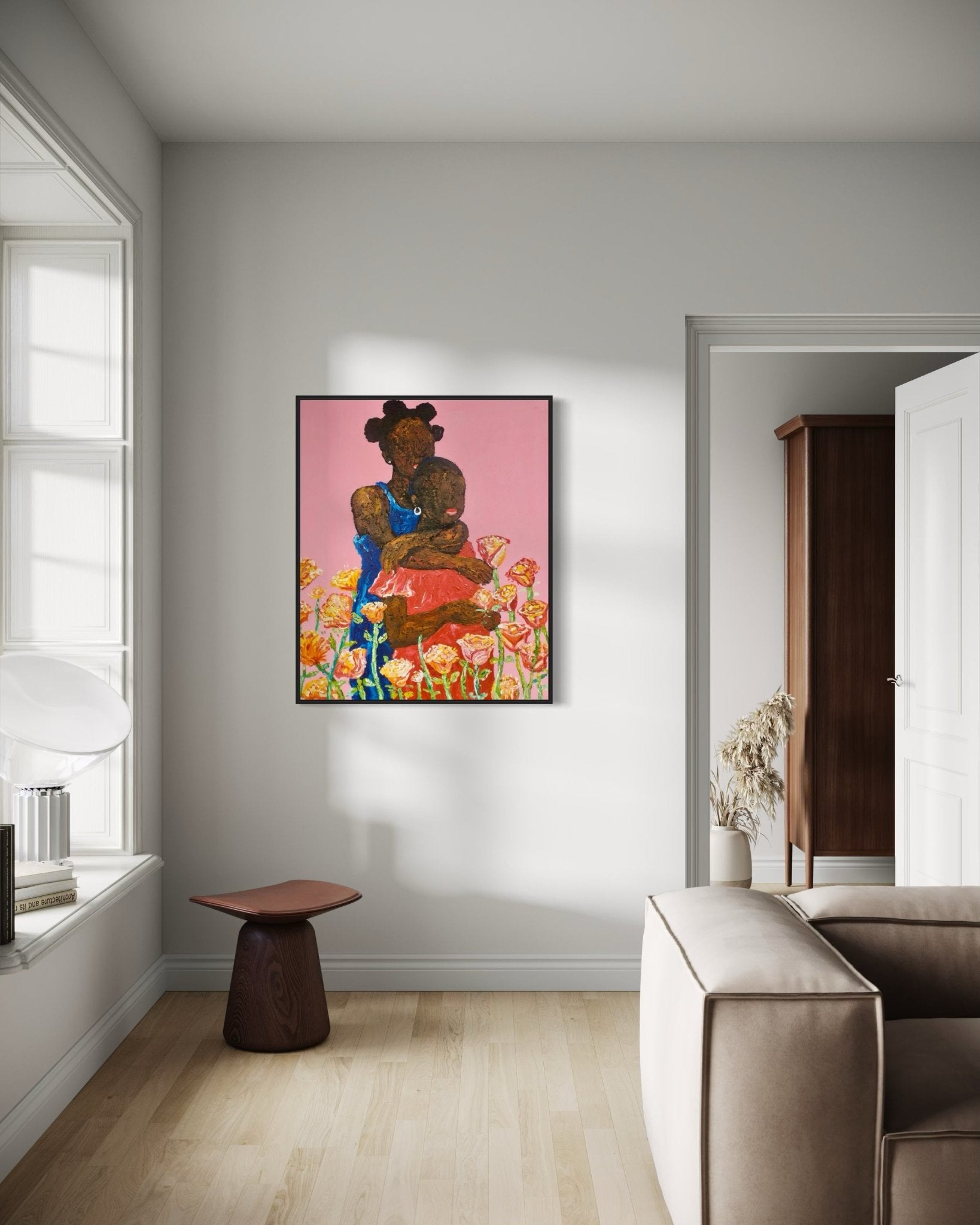 A modern living room with light walls and wooden floors features a beige sofa, a brown side table, and 'Companion. Acrylic on Canvas' by Ola Kuti displayed above floral artwork.