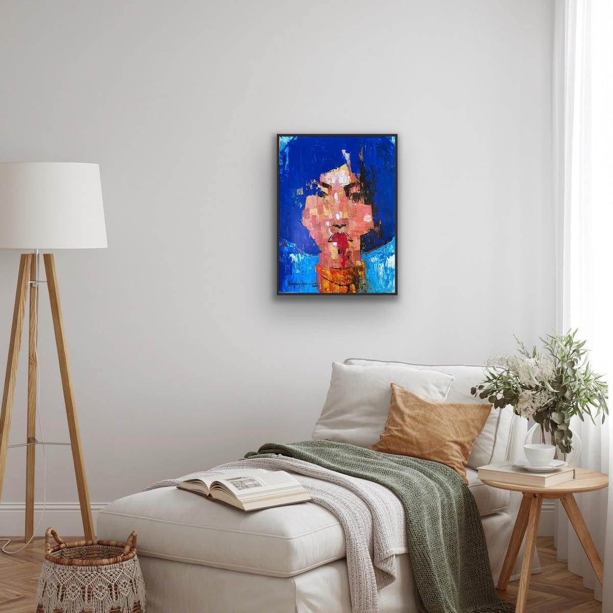 A cozy, modern living room features a white lounge chair and an original “One of a Kind Series” acrylic on paper by Olasunkanmi Oyelusi, ready to be framed.