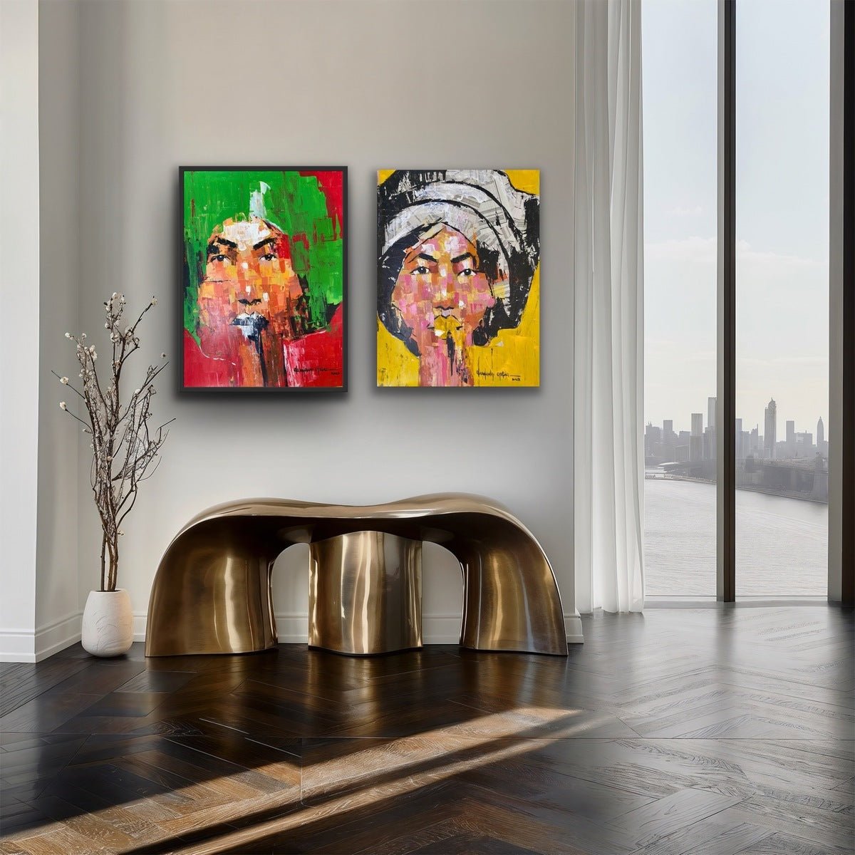 A modern room with dark herringbone floors, a sculptural gold bench, a small vase with twigs, and two unique artworks from the One of a Kind Series by Olasunkanmi Oyelusi adorn the wall. Large windows overlook the river and skyline.