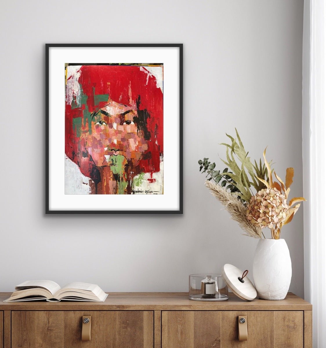 From the One of a Kind Series by Olasunkanmi Oyelusi, this original acrylic portrait on paper shows a red-haired face and is displayed above a wooden cabinet with decor—ready for framing.