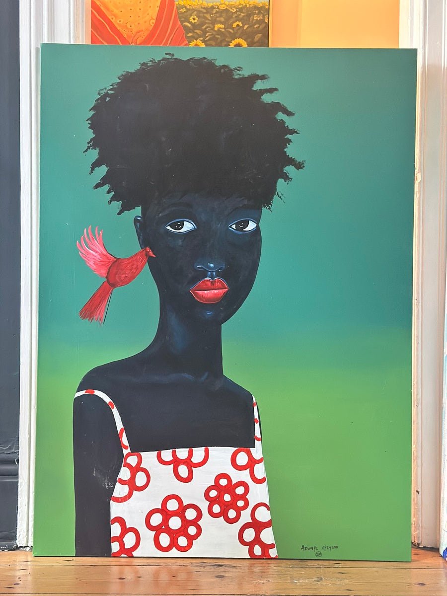 “Phoenix” by Afuope Opeyemi is an acrylic on canvas featuring a Black child in a white dress with red flowers and a red bird on the shoulder, set against a green background. Each hand-signed original artwork comes from the Afuope Opeyemi brand.