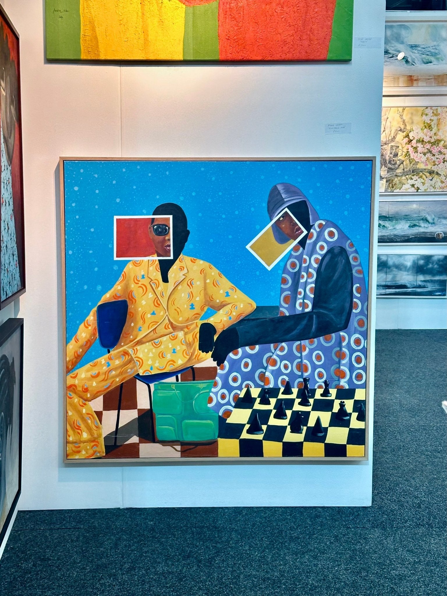 “Renaissance Man” by Afuope Opeyemi is a vibrant, hand-signed acrylic on canvas featuring two abstract figures at a chessboard. One wears yellow, the other purple, set against a blue and white dotted background—perfect for adding flair to any space.