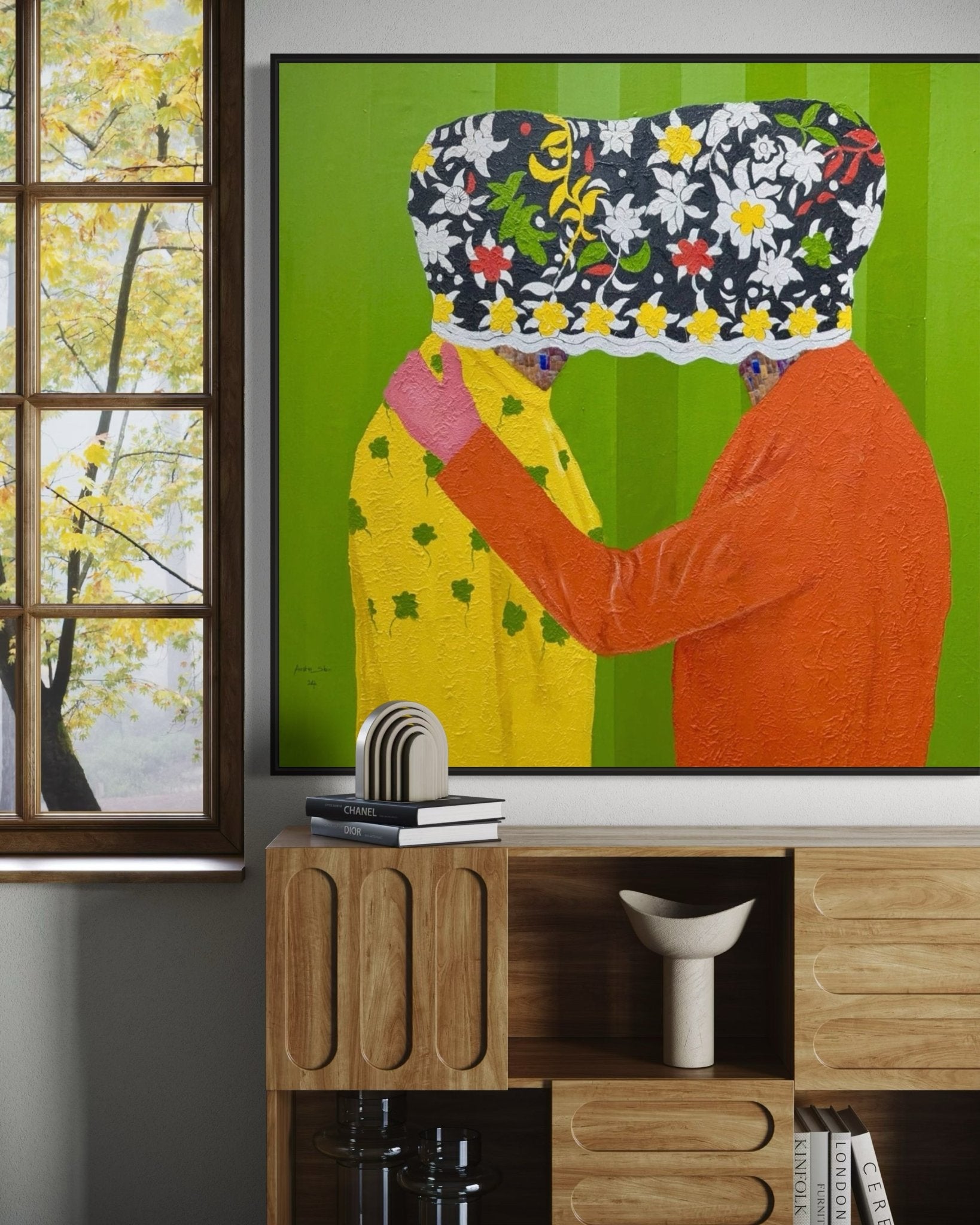Secrets" by Slam Austin (122 x 122cm), a large textured painting of two figures embracing beneath a floral cloth, hangs above a wooden sideboard on a green wall near a window revealing autumn leaves.