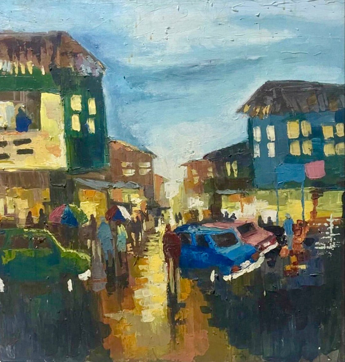 Somewhere in Ibadan II" by Pitar Alakhume captures a lively city street at dusk with people carrying umbrellas, colorful buildings, and cars on a wet road. This original artwork is hand-signed and includes a certificate of authenticity.