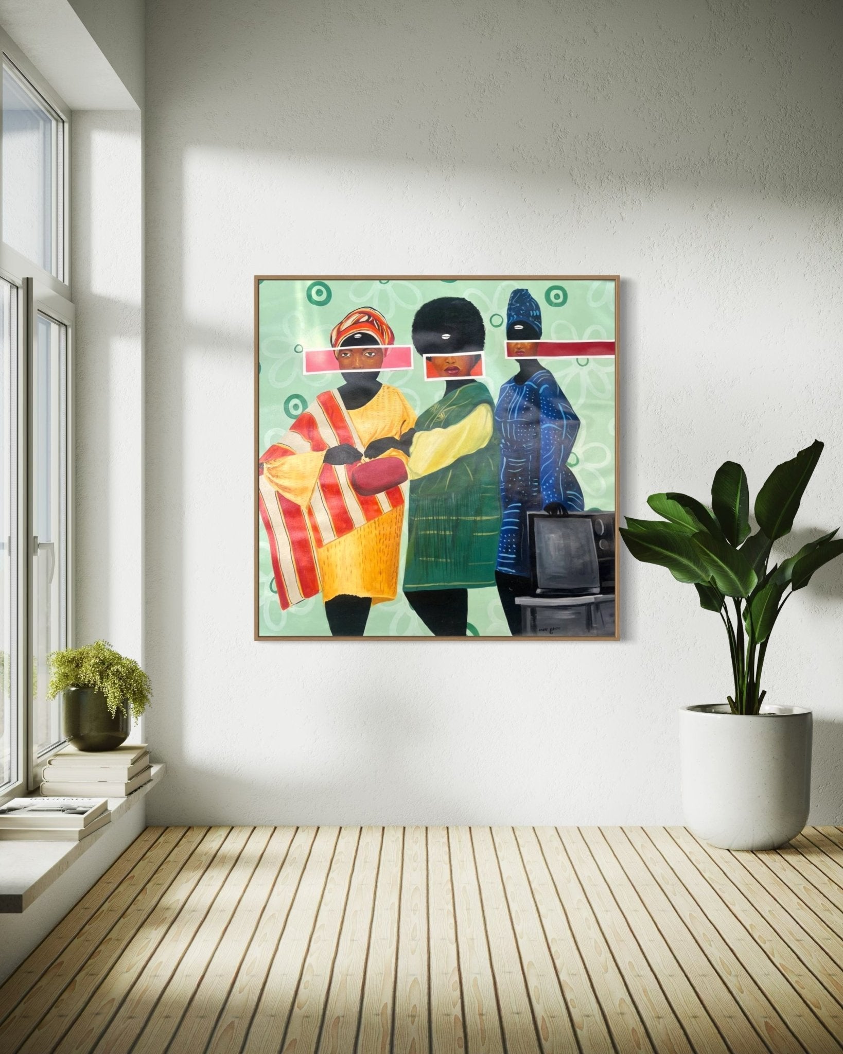Sunday Best" by Afuope Opeyemi, a vibrant acrylic on canvas of three abstract figures with eyes hidden by pink bars, hangs on a white wall in a bright, minimalist room with wooden floors, a large plant, and natural light.