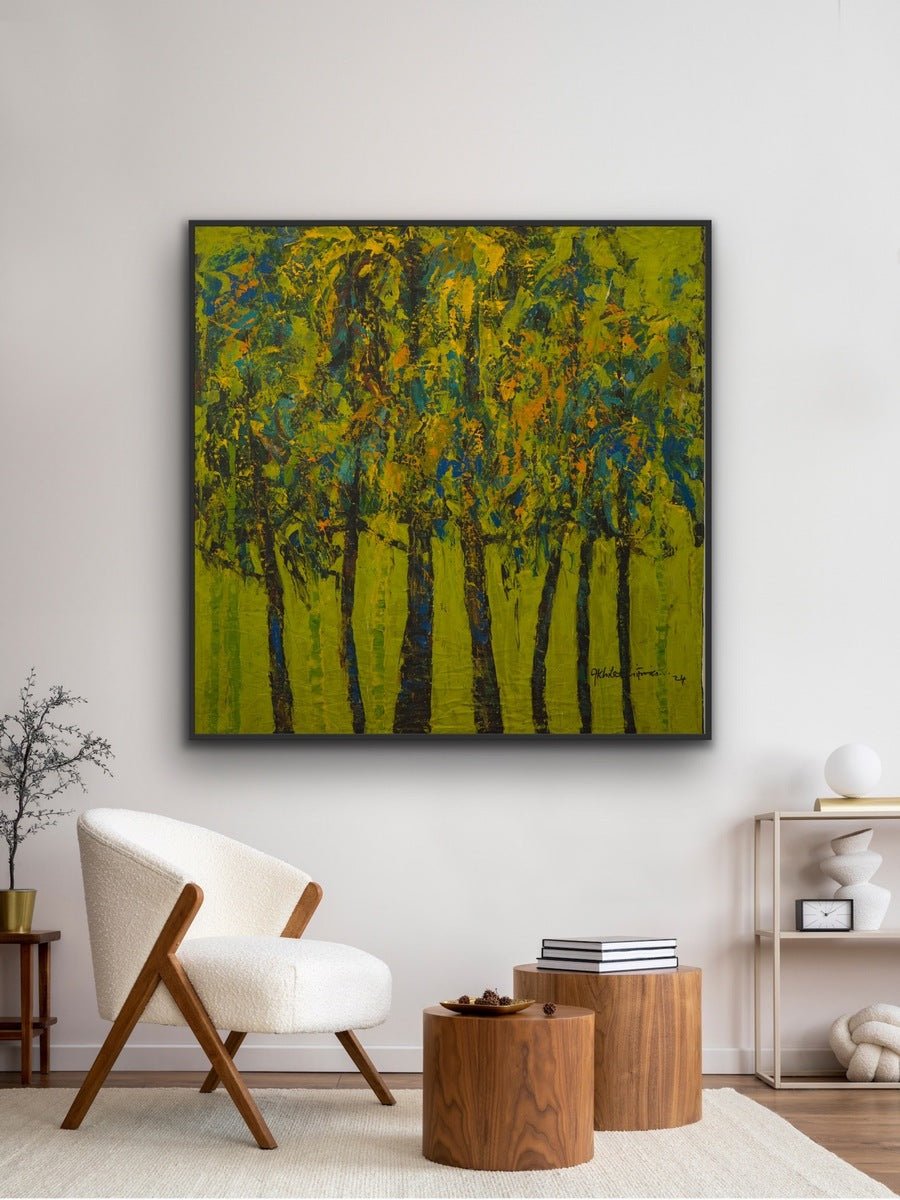 A modern living room with a white armchair, wooden side tables, minimalist décor, and Akhile Ehiforia's XL original painting "The Forest" adding vibrant color to the wall.