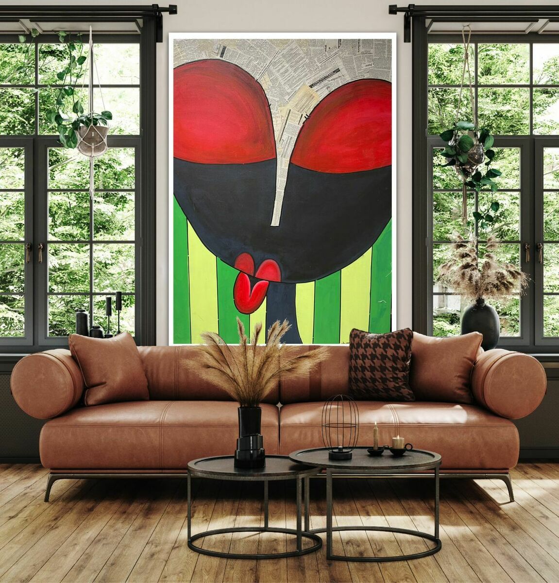 A stylish living room features a tan sofa, round coffee tables, pampas grass decor, large windows, and “The Look” Contemporary Nigerian Abstract Painting by Yusuf Lawal—an acrylic mixed media artwork in red, black, and green—above the sofa.