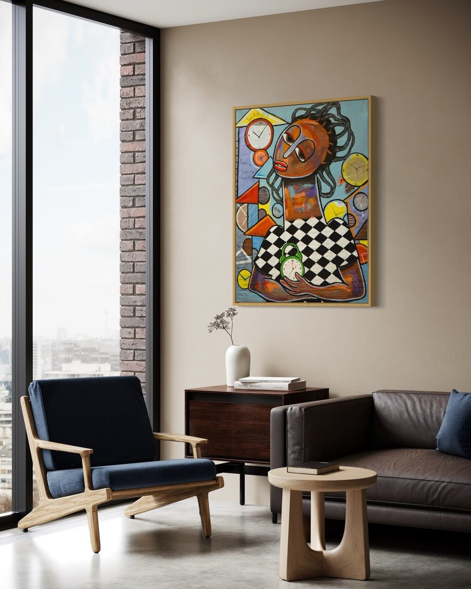 A modern living room features a dark blue armchair, brown leather sofa, wooden table, and cabinet with white vase. "Time for Everything" by Achike Anayo, acrylic on canvas, hangs on the beige wall beside city-view windows.