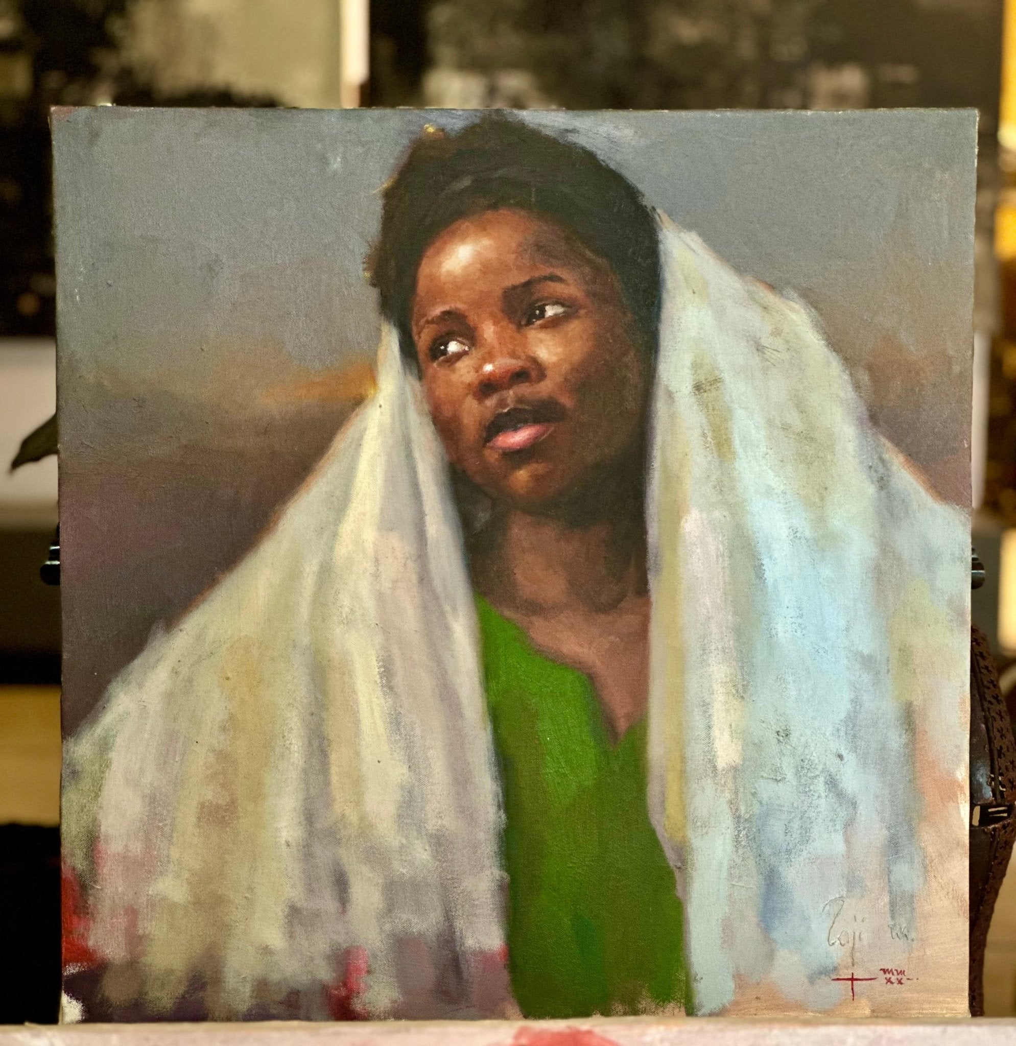 “Towards A Brighter Future” by Raji Mohammed features a woman with dark skin, short hair, a green dress, and white cloth draped over her head and shoulders, gazing upward thoughtfully in an oil painting style.