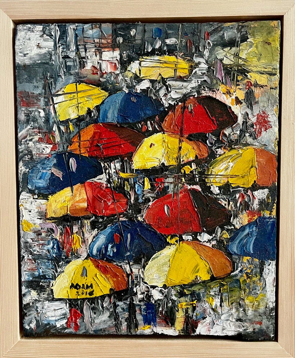The "Umbrellas in The Sun. Street Market" by Adam is a heavily textured miniature acrylic painting showing a lively Nigerian street scene with people holding colorful umbrellas, painted with bold brushstrokes and framed in light wood.