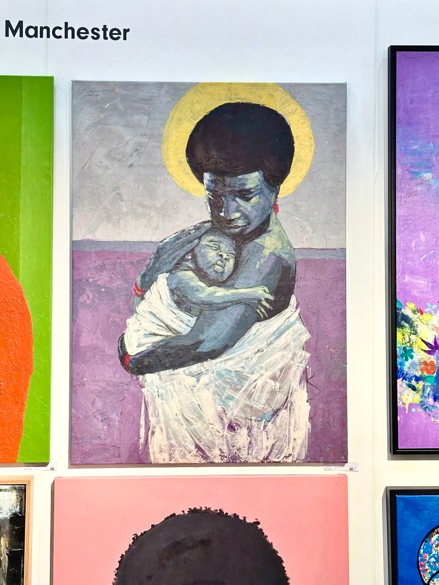 "Intimate" Portrait of the connection between a parent and baby in close embrace.