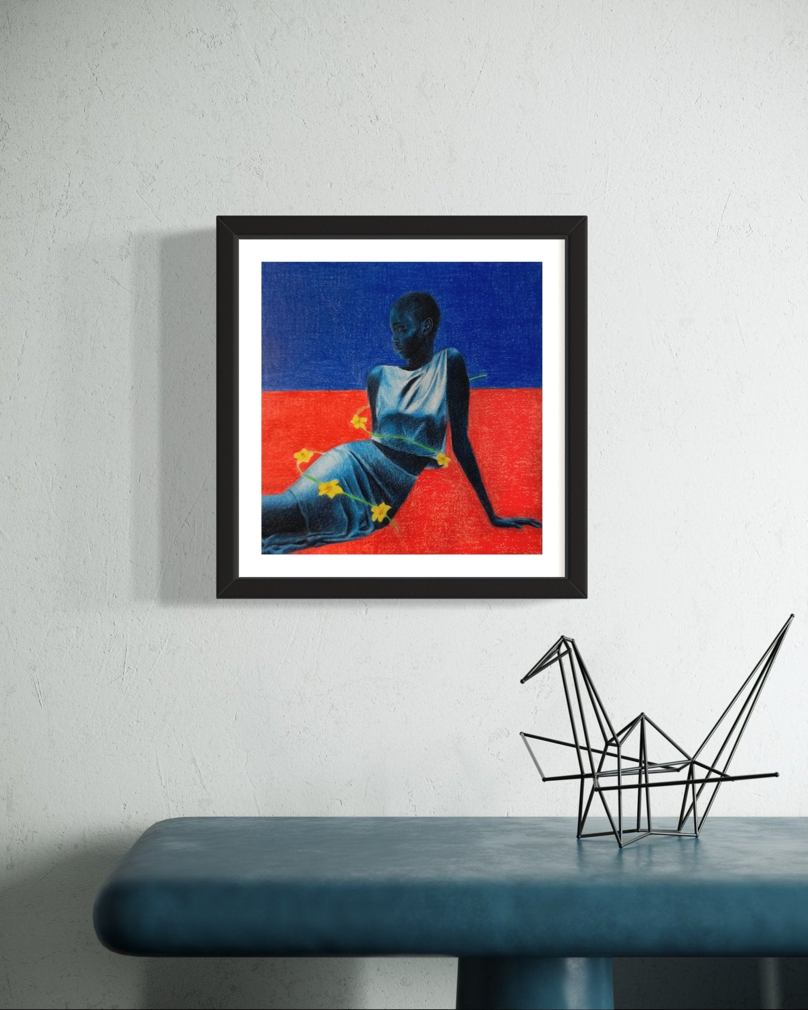 Blue Maiden II" by Mubarak Omotoyosi, a hand-signed painting in a black frame, hangs on a white wall above a blue table with a black wire origami horse; includes certificate of authenticity.