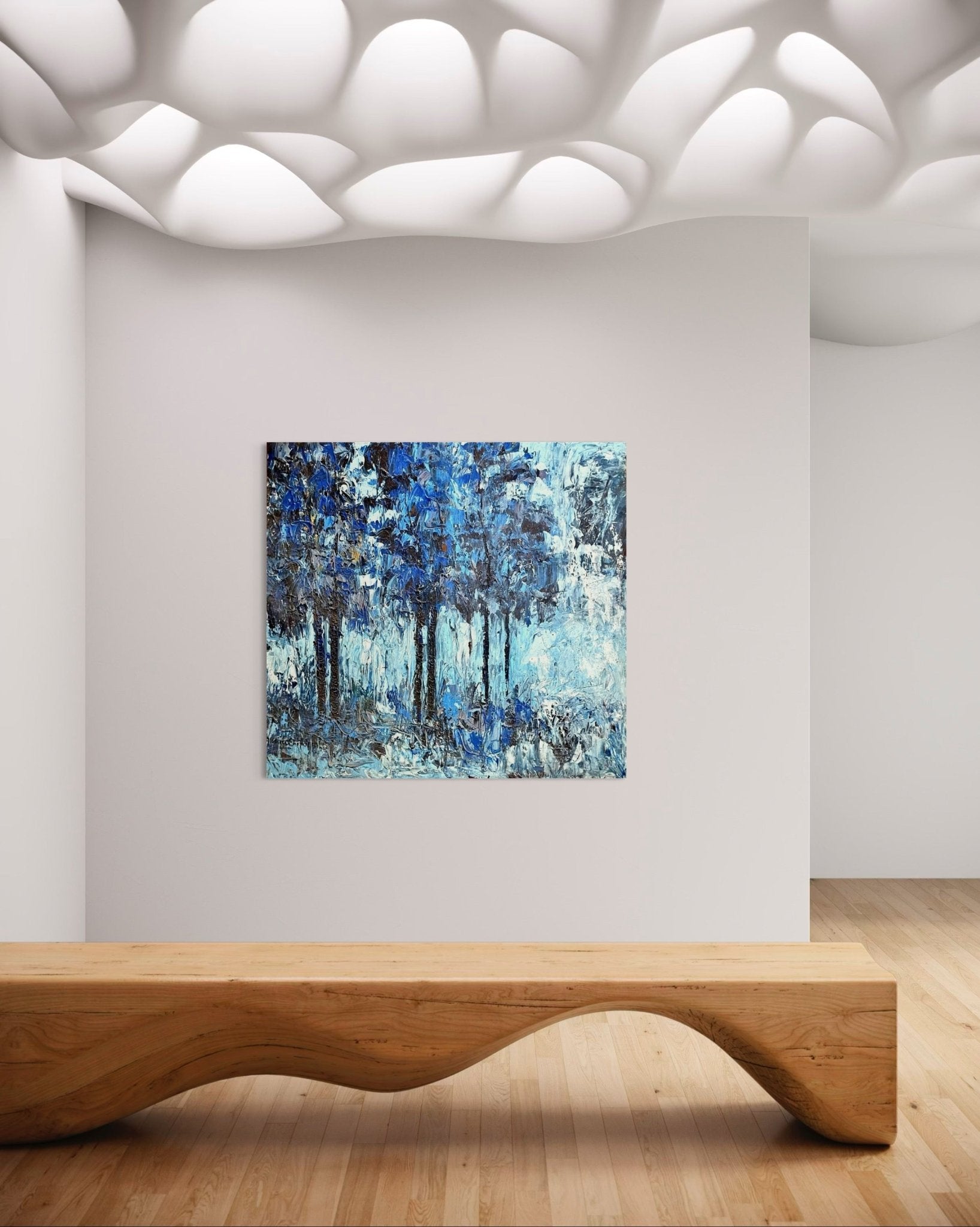 A modern minimalist room includes a wavy wooden bench, textured ceiling with organic shapes, light wood flooring, and “Growth Series”—an extra large textured impasto nature painting by Akhile Ehiforia—displayed on a plain white wall.