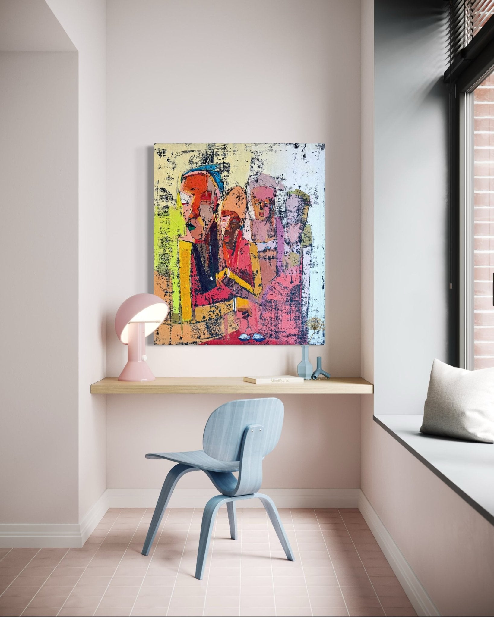 A small, modern workspace with a light blue chair, wooden floating desk, pink lamp, and 'Gender Equality'—a colorful hand-signed painting by Dolapo Ogunnusi with certificate of authenticity. Large window with bench seating fills space with light.