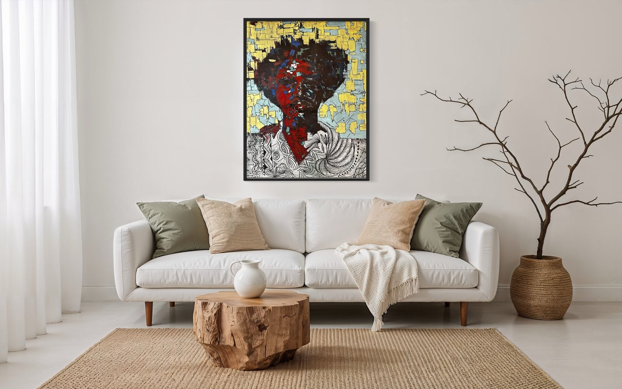 A modern living room features a white sofa, beige pillows, and a light throw blanket. A wooden stump coffee table rests on a woven rug. "Man Of Value" by Akinwunmi, hand-signed with certificate, and abstract decor complete the space.