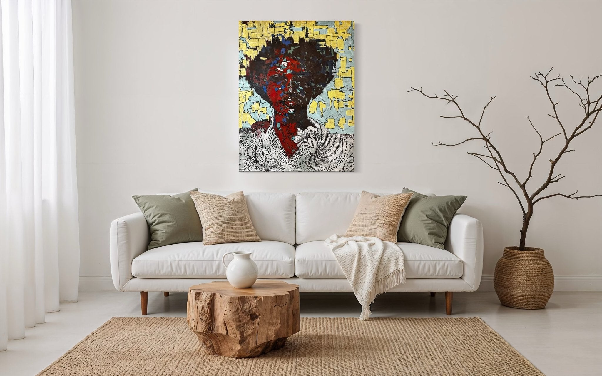 A modern living room with a white sofa, neutral pillows, wooden coffee table, woven rug, large potted branch, and "Man Of Value"—an original hand-signed colorful portrait by Akinwunmi—displayed above the sofa.