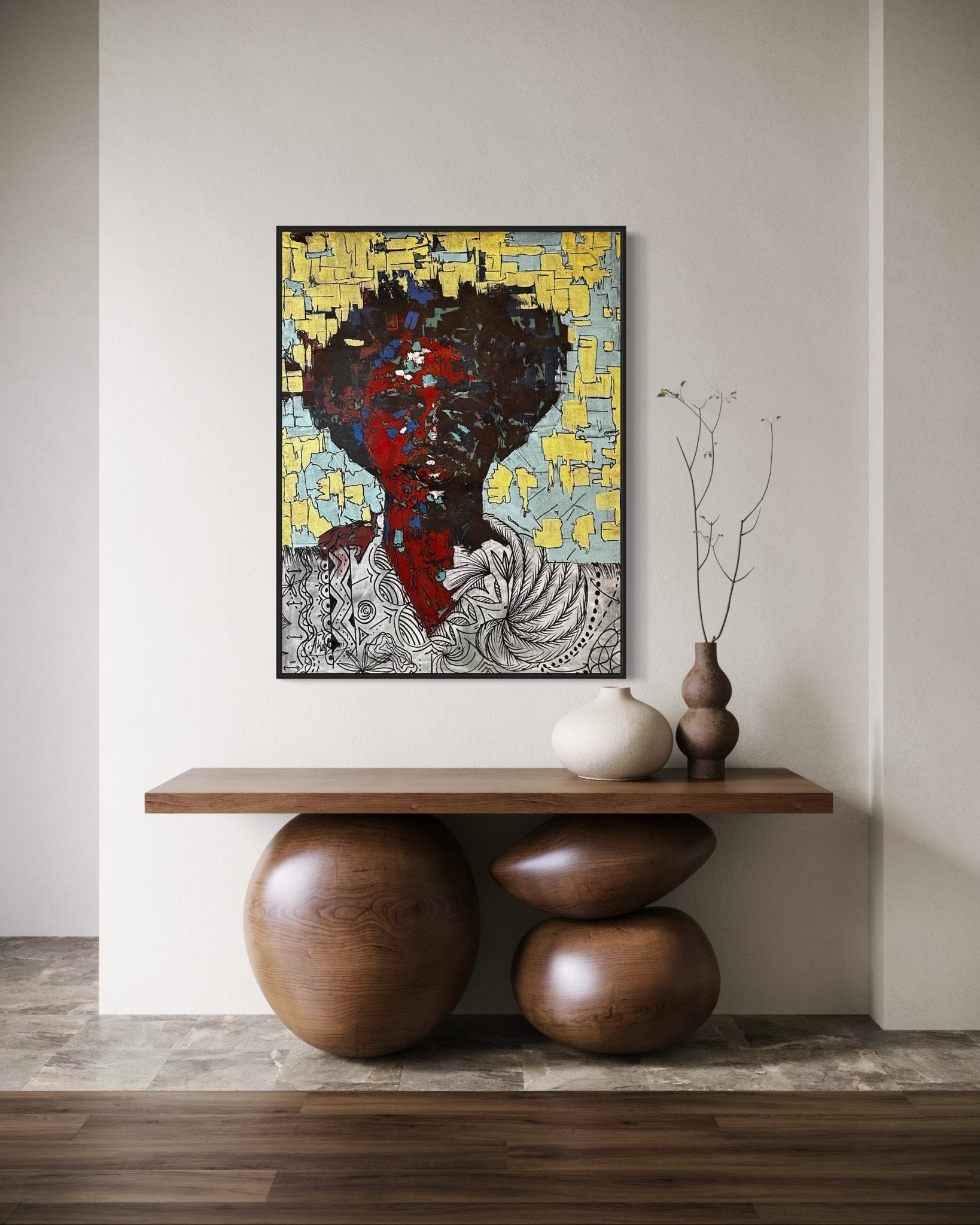 A modern entryway features a unique wooden table with rounded supports, three minimalist vases, and "Man Of Value" by Akinwunmi—a colorful abstract portrait set against a yellow and blue textured background above.