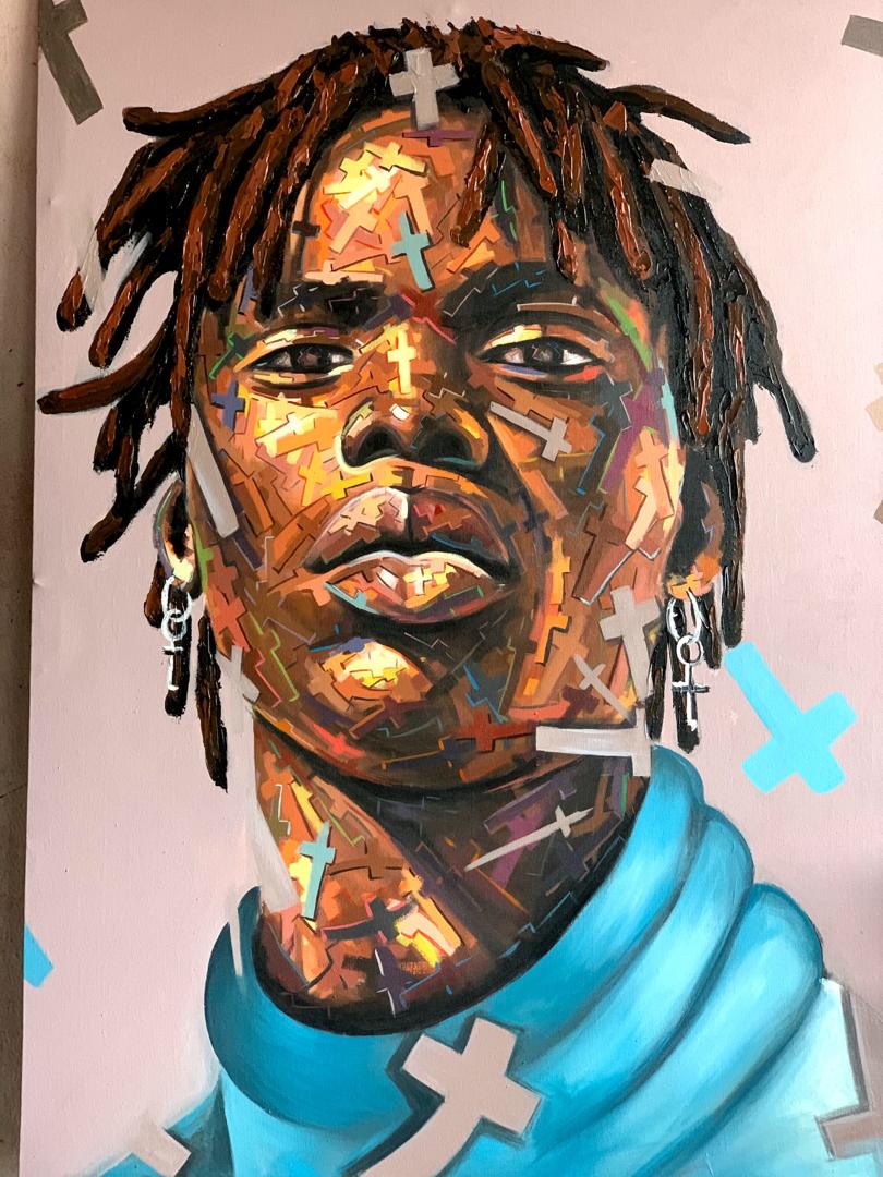 A vibrant painting by Agboola Emmanuel I, 'Manifest' Expressionist portrait, depicts a person with short dreadlocks, silver cross earrings, and a blue turtleneck amid colorful abstract crosses on their face and background.